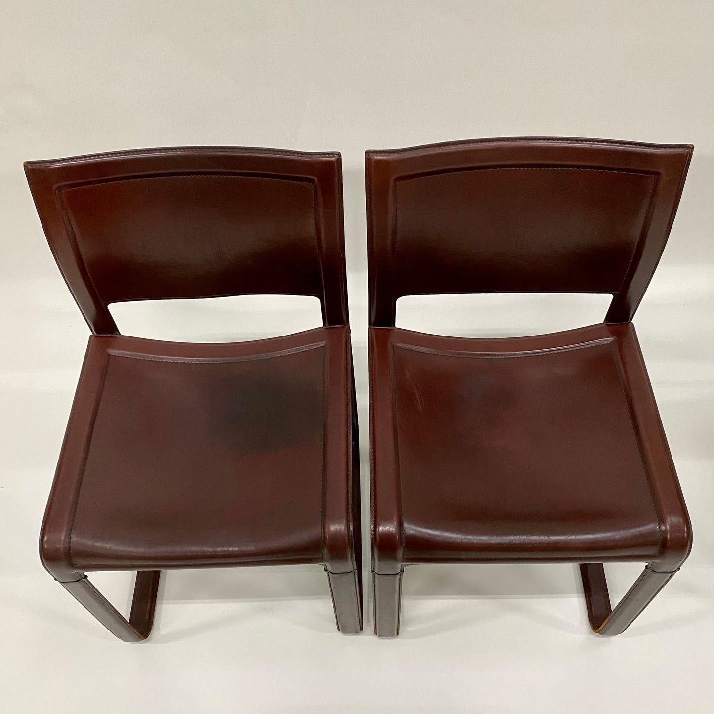 Set aus 4 burgunderfarbenen Sistina Strap Chairs aus Leder von Tito Agnoli für Matteo Grassi, Italien 1980