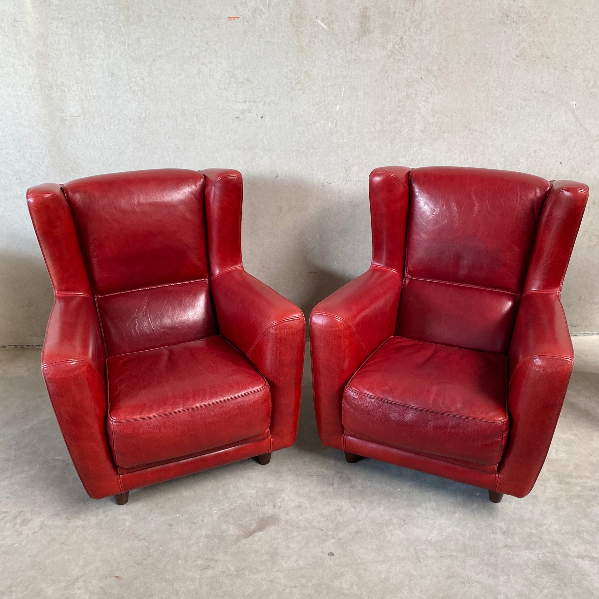 OX-BLOOD RED LEATHER LOUNGE CHAIRS "BERGÈRE" BY BAXTER, ITALY