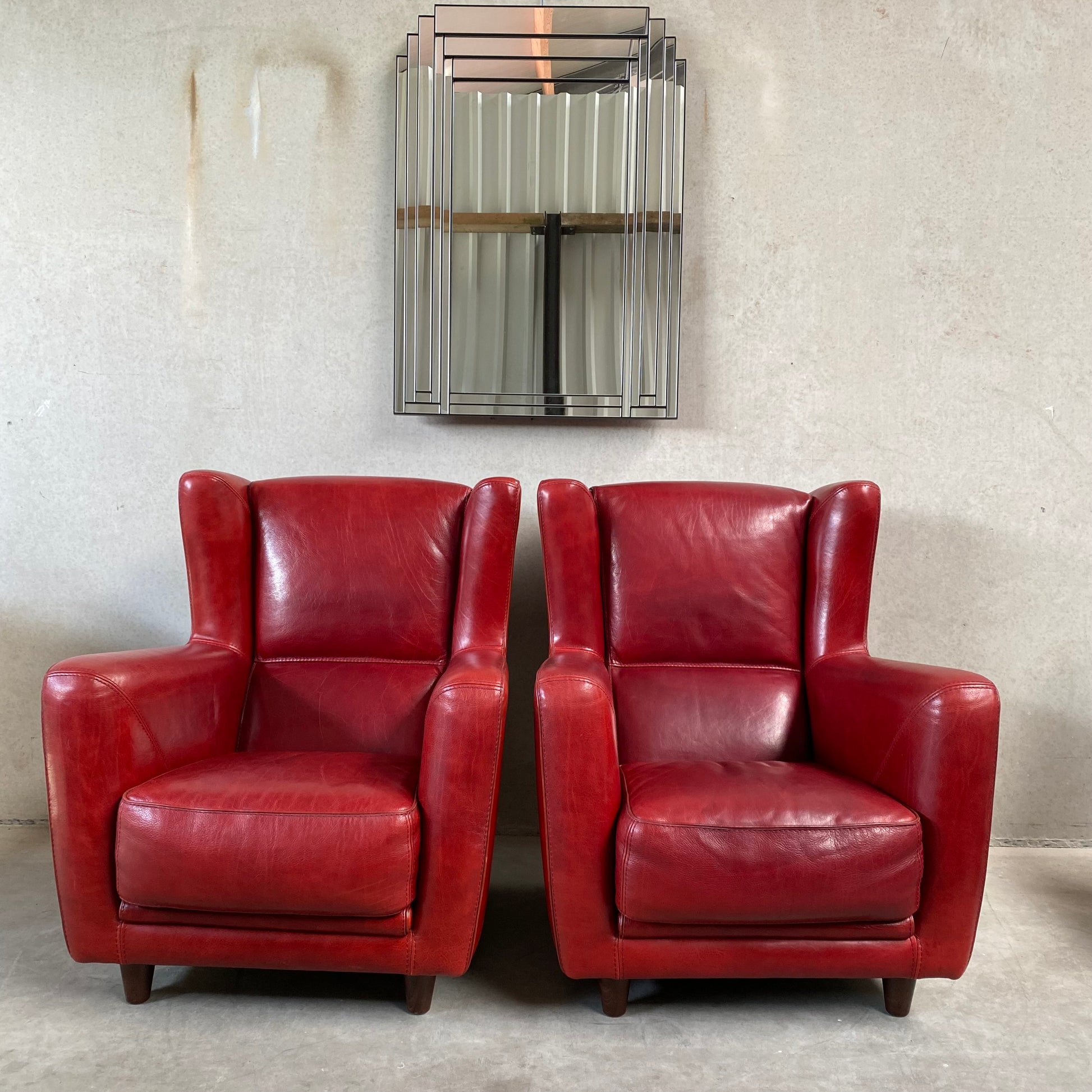 OX-BLOOD RED LEATHER LOUNGE CHAIRS "BERGÈRE" BY BAXTER, ITALY