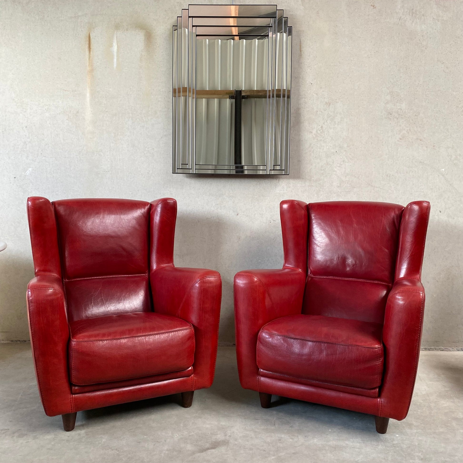 OX-BLOOD RED LEATHER LOUNGE CHAIRS "BERGÈRE" BY BAXTER, ITALY