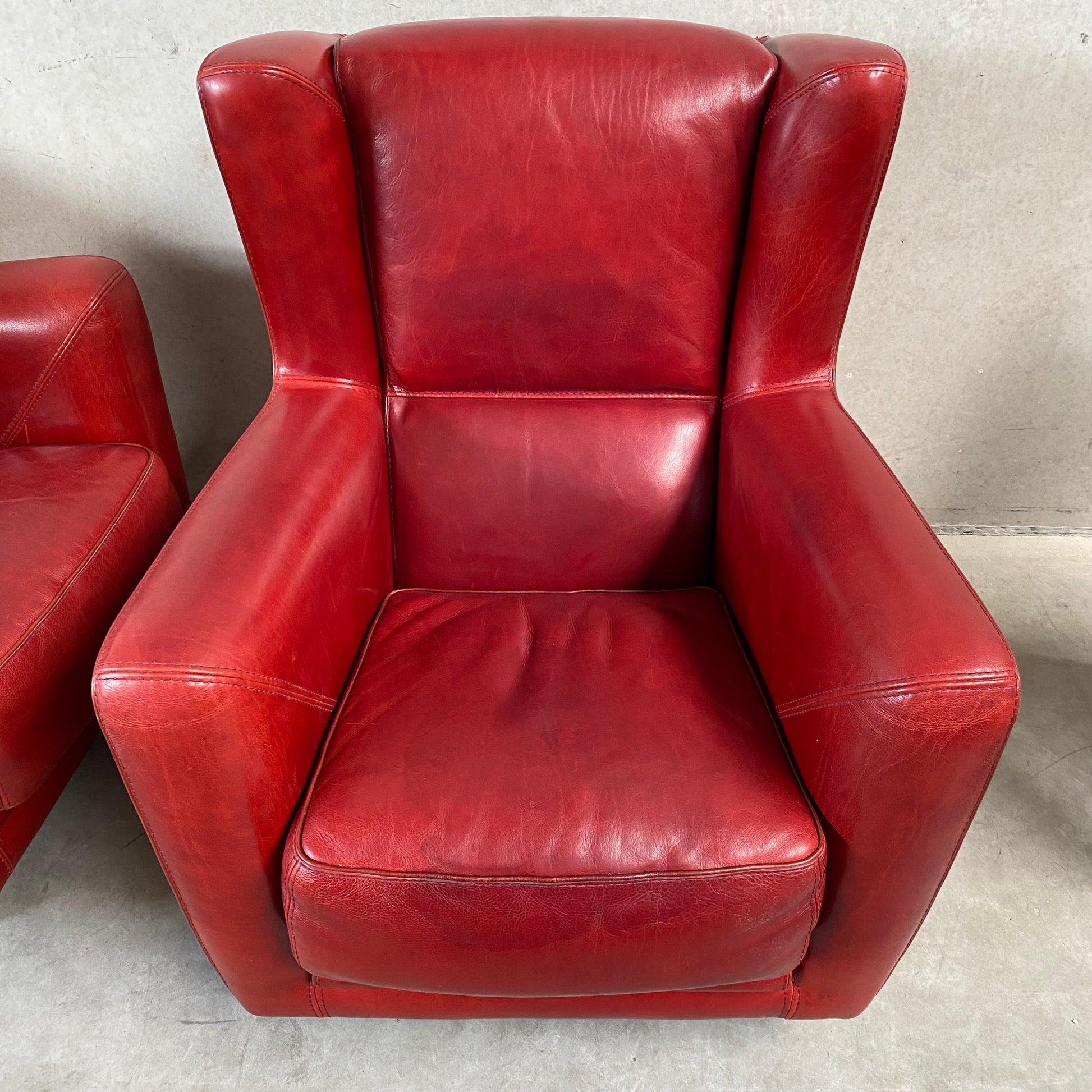 OX-BLOOD RED LEATHER LOUNGE CHAIRS "BERGÈRE" BY BAXTER, ITALY
