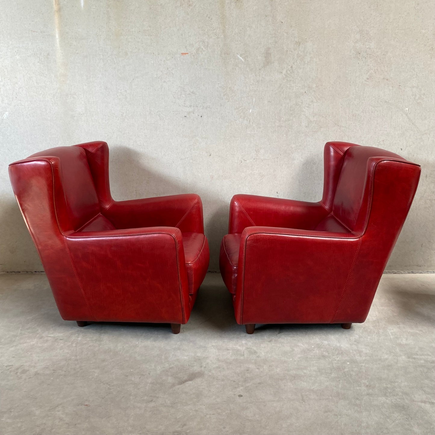 OX-BLOOD RED LEATHER LOUNGE CHAIRS "BERGÈRE" BY BAXTER, ITALY